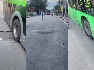 Новый асфальт просел в Алматы, "взяв в плен" автобусы